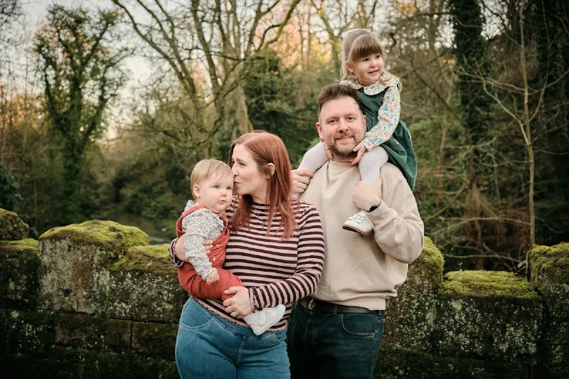 Parents hugging their children during a Mother's Day photoshoot in Jesmond, Newcastle upon Tyne
