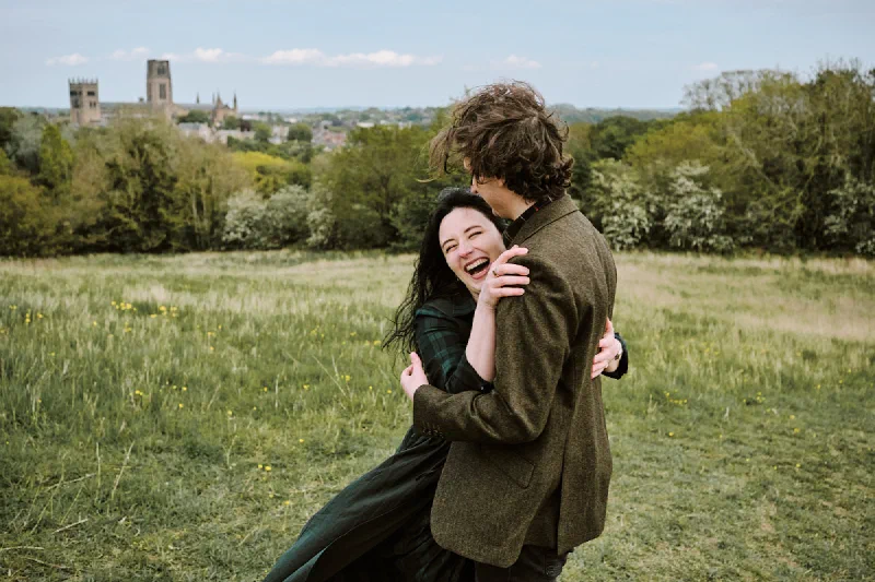 A joyful embrace after the surprise proposal in Durham