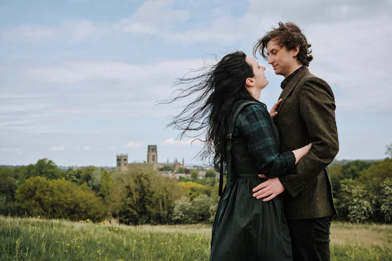 A natural couple portrait with Durham Cathedral in the distance