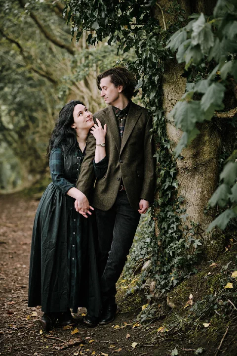 A romantic portrait of the couple on a wooded path in Durham