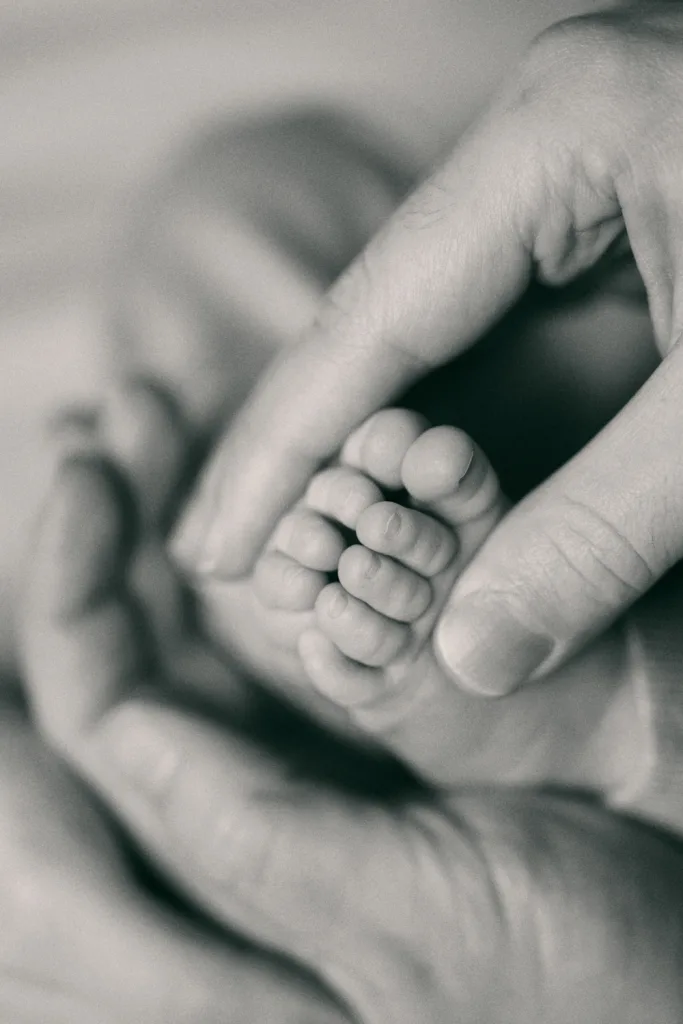 Tiny baby feet on bed during lifestyle newborn session Jesmond